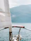 View from a sailing boat of Lake Garda and the surrounding mountains