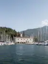 Porto San Nicolò with sailing boats and its historic harbour building