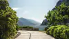 A view across a garden towards Lake Garda in Riva del Garda