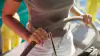 A sailor at the helm of a sailing boat during a trip on Lake Garda